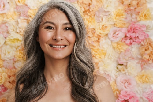 Preview: Smiling mature topless woman standing posing