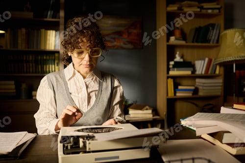 Preview: Middle Aged Caucasian Woman Typing Manuscript on Typewriter in Library