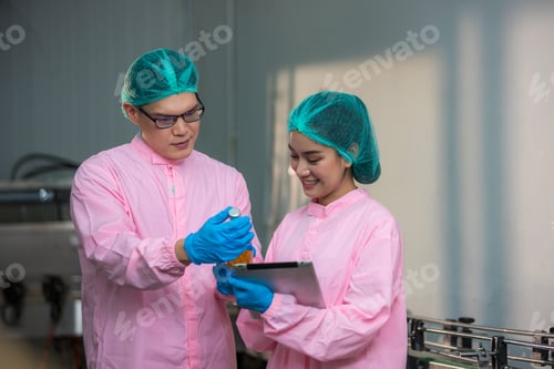 Preview: Worker Checking quality or checking stock of glass bottle in beverage factory.