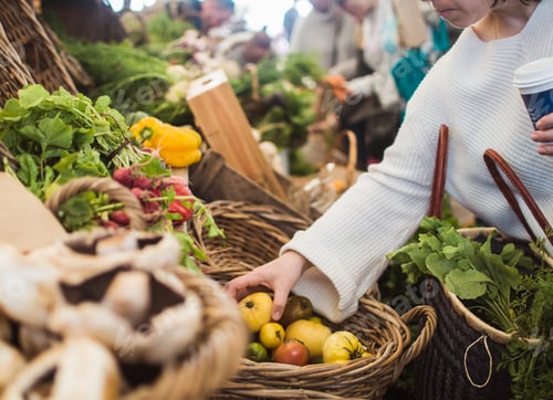 Preview: Woman shopping vegetables at farmers market