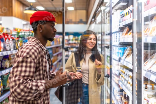 Preview: Diverse couple shopping for food in grocery store