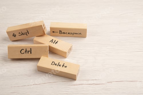 Preview: bottom view keyboard icons on wood blocks on wooden table with fee space