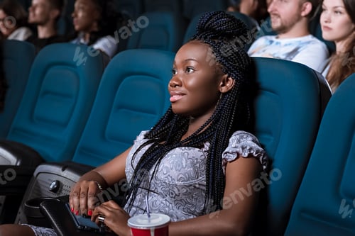 Preview: Beautiful African woman enjoying a movie