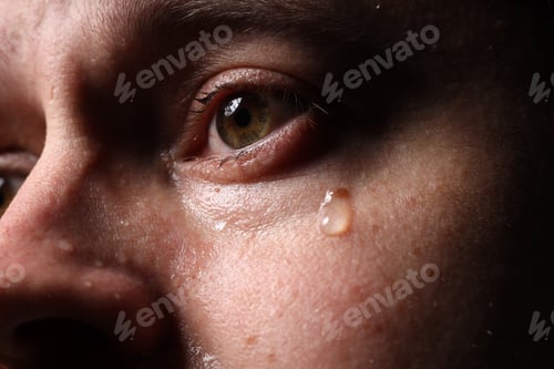 Preview: Closeup view of man crying. Feelings of sadness