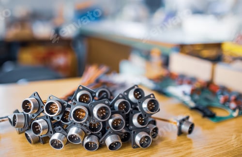 Preview: Close-up blurry metal sockets for plugs are in a heap