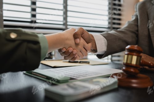 Preview: lawyer and client shake hands after receiving bribes for illegal deals