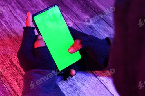 Preview: hacker hand stealing data from smart phone
