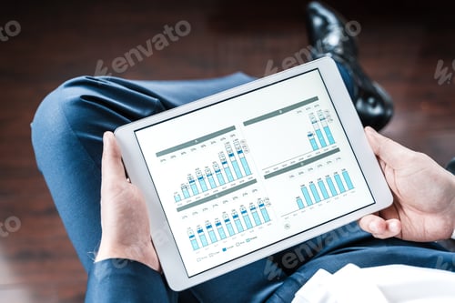 Preview: Working businessman,investor,trader.Financial report,presenatation in tablet.Diagram,gantt chart, an