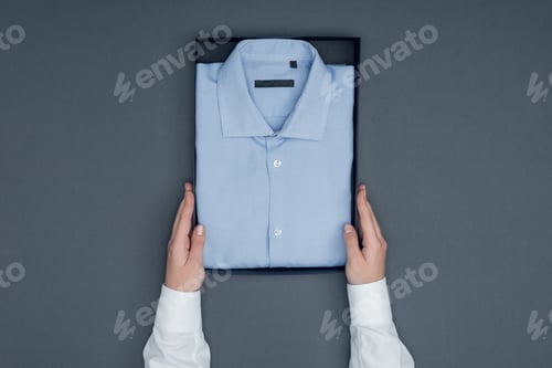 Preview: Folded Shirt in Box on Gray Background