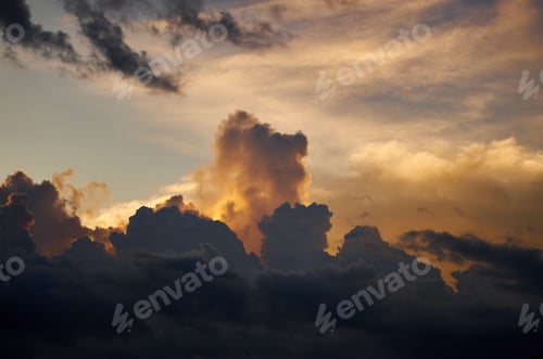 Preview: A dark cloud with a sunset in the clouds