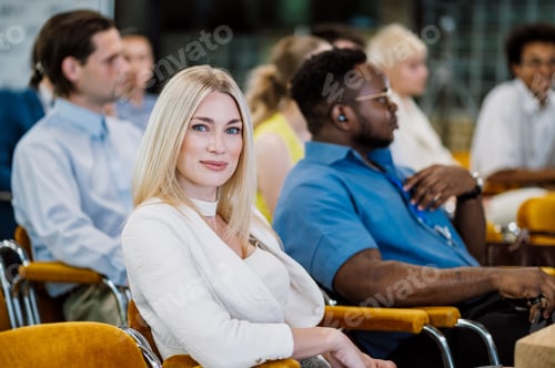 Preview: Woman Smiling Attending a Business Conference with Colleagues