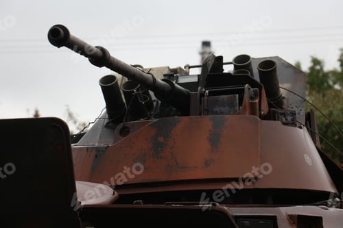Preview: Old metal tank with long Turret in the park with trees