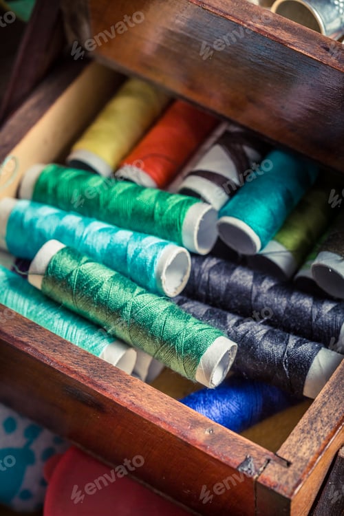 Preview: Old tailor's wooden box with needles, threads and buttons
