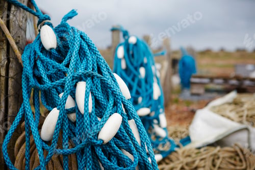 Preview: Close up of a tangle of blue fisherman's rope with white floats.