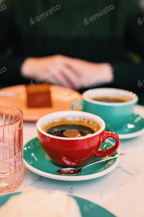 Preview: Two cups of black coffee on the table, lifestyle image in a cafe