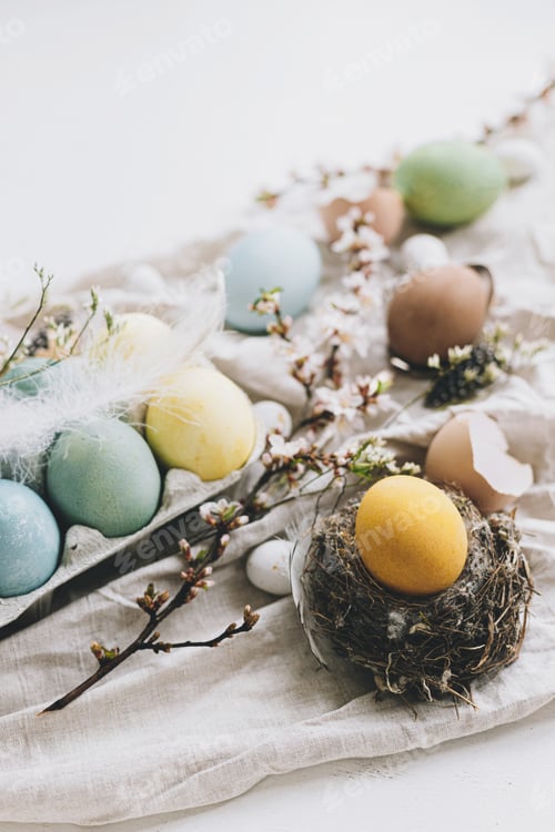 Preview: Stylish Easter eggs and cherry blossom on rustic linen background. Happy Easter!