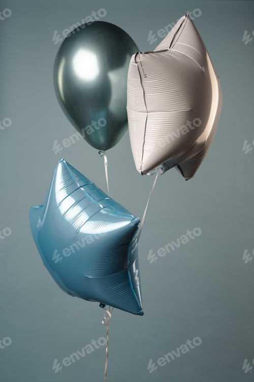 Preview: Photo of three balloons isolated over grey background