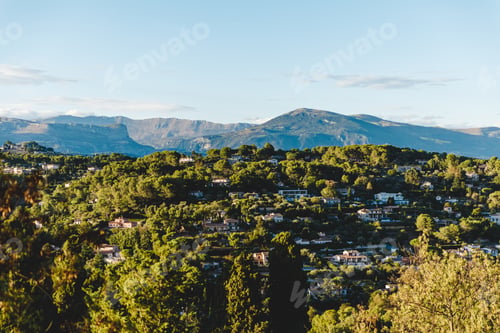 Preview: aerial view of beautiful european town in mountains on sunset, Cannes, France