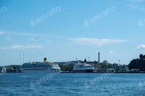 Preview: Stockholm Sweden Port, cruise ship moored in port, ripple Baltic sea water, blue sky background.