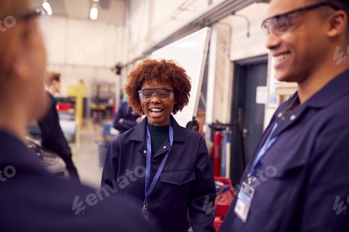 Preview: Students Studying For Auto Mechanic Apprenticeship At College Standing By Whiteboard
