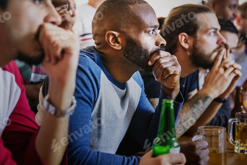 Preview: Frieds cheering sport at bar together