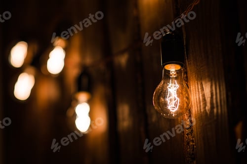 Preview: Vintage incandescent Edison type bulbs on wooden wall
