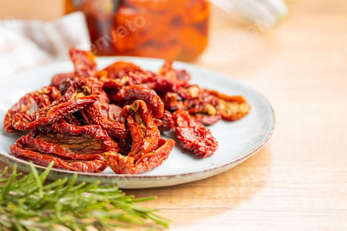 Preview: Sun dried tomatoes on plate.
