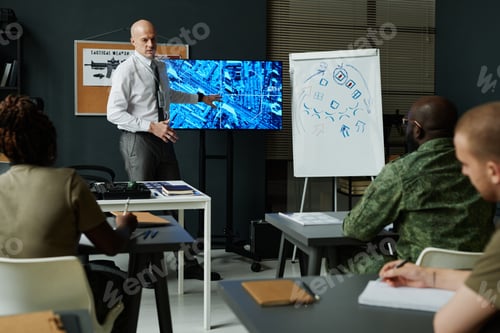 Preview: Group of intercultural students looking at confident military coach