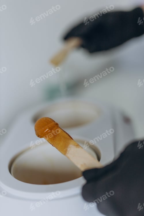Preview: Sugar paste for shugaring depilation. Beauty spa minimalist concept.
