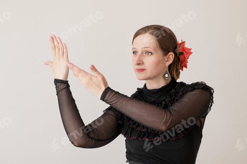 Preview: Beautiful young woman dancing flamenco in a black dress