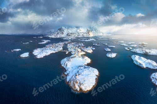 Preview: Aerial view of snowy Lofoten islands, Norway in winter at sunset