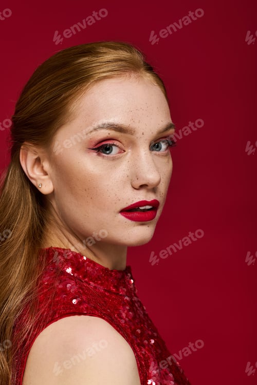 Preview: Young woman with radiant beauty and stunning red outfit against a vibrant background
