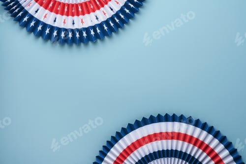 Preview: 4th of July background. USA paper fans, Red, blue, white stars and confetti on blue wall background.