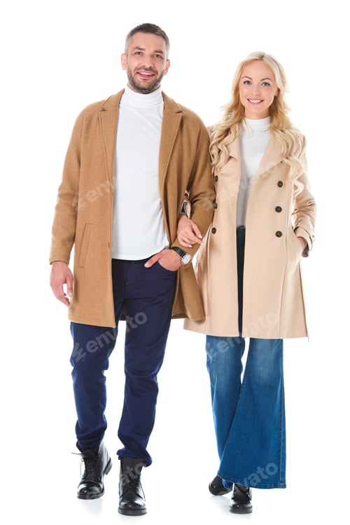 Preview: couple posing in trendy beige autumn coats, isolated on white
