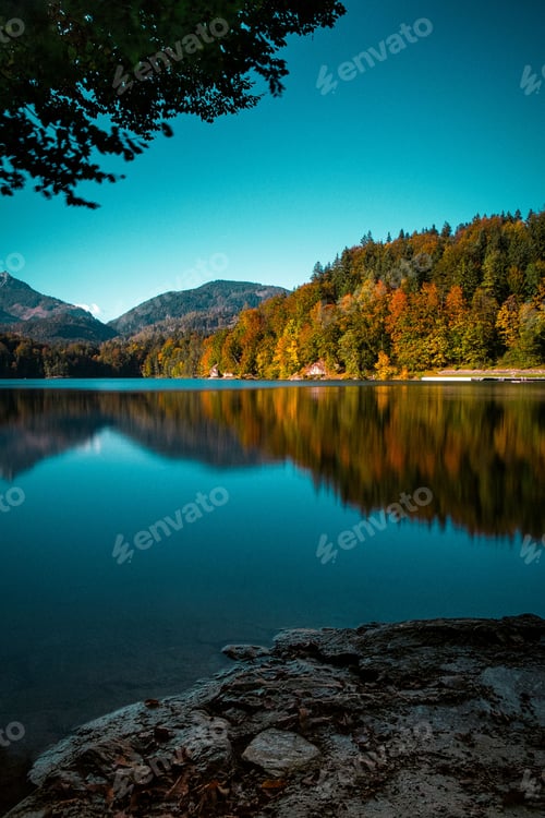 Preview: Breathtaking view of colorful autumn trees on the lake shore