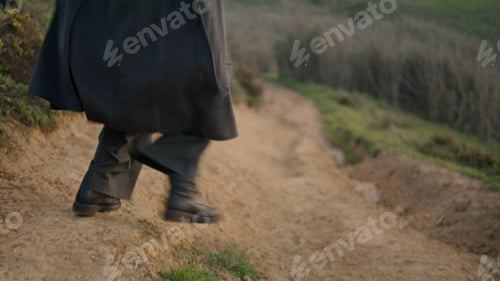 Preview: Woman legs running path in black boots close up. Active girl jogging on road.