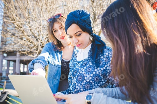 Preview: Multiracial group young people using computer