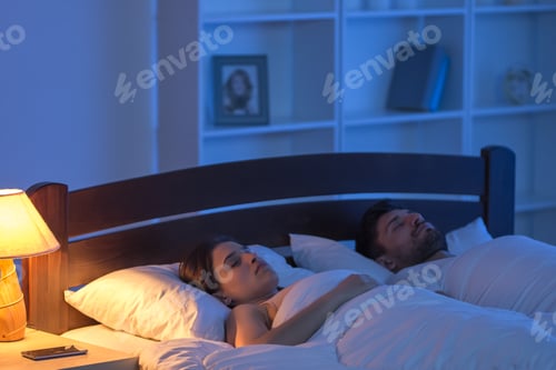 Preview: The man and woman sleeping in the bedroom. night time