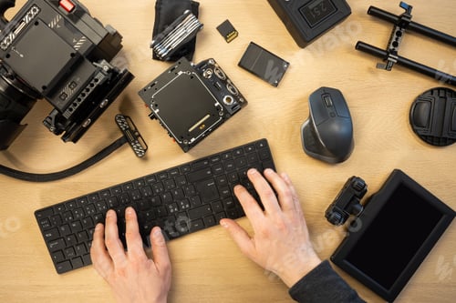 Preview: Cropped hands using computer keyboard by various equipment at table
