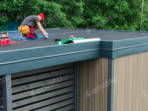 Preview: Skilled Worker Performing Maintenance on a Modern Flat Roof in Daylight