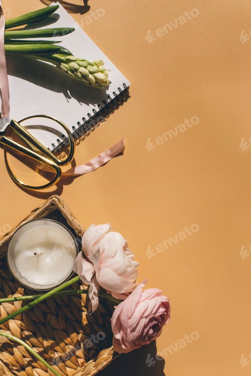 Preview: pink flowers and candle top view with copy space