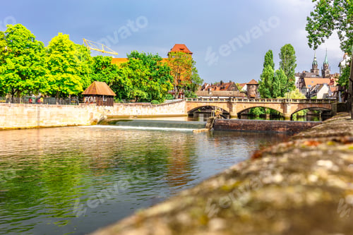 Preview: Colourful historic old town with half-timbered houses of Nuremberg. Bridges over Pegnitz river
