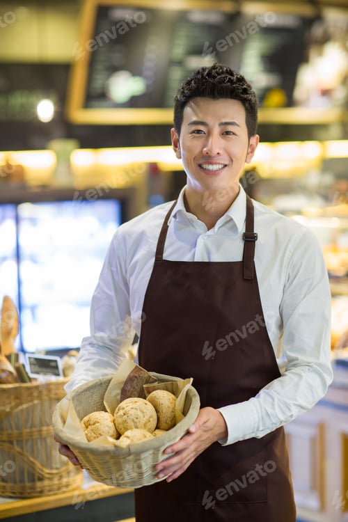 Preview: Young man working in bakery