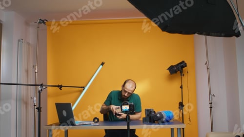Man with Camera Preparing for a Video Shoot