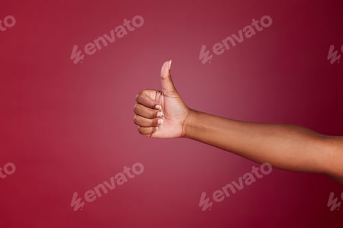 Preview: Thumbs up, yes and agreement hand sign of a black woman showing support, motivation and success. Th