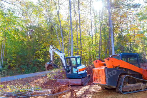 Preview: An uprooted tree is uprooted by a tractor during construction, preparing land for building