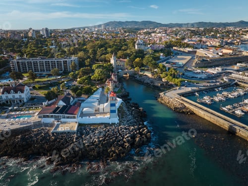 Preview: Aerial view of Santa Marta lighthouse and Cascais marina with Cascais cityscape