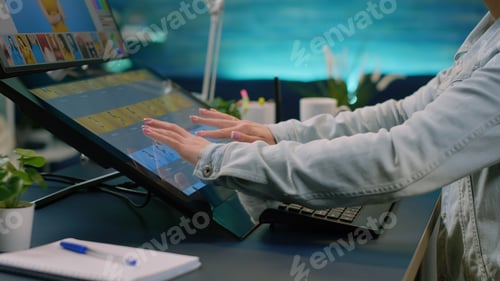 Preview: Close up of photographer hands using touch screen monitor