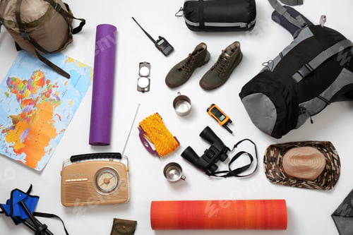 Preview: Flat lay composition with camping equipment on white background