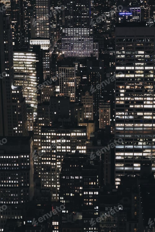 Preview: City Buildings Lit Up at Night in Urban Setting